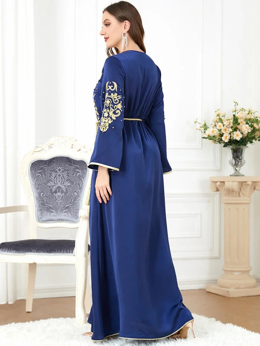 Elegant long-sleeve dress with floral embroidery in a sophisticated sapphire blue colour, suitable for British women