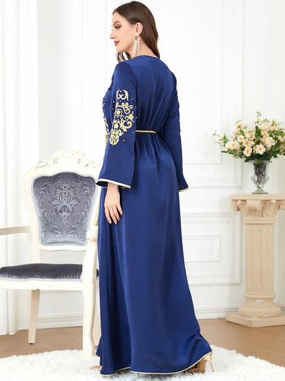 Elegant long-sleeve dress with floral embroidery in a sophisticated sapphire blue colour, suitable for British women