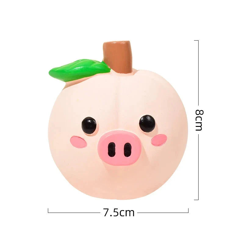 Colourful fruit-shaped squeaky dog toy made of durable, chew-resistant latex material