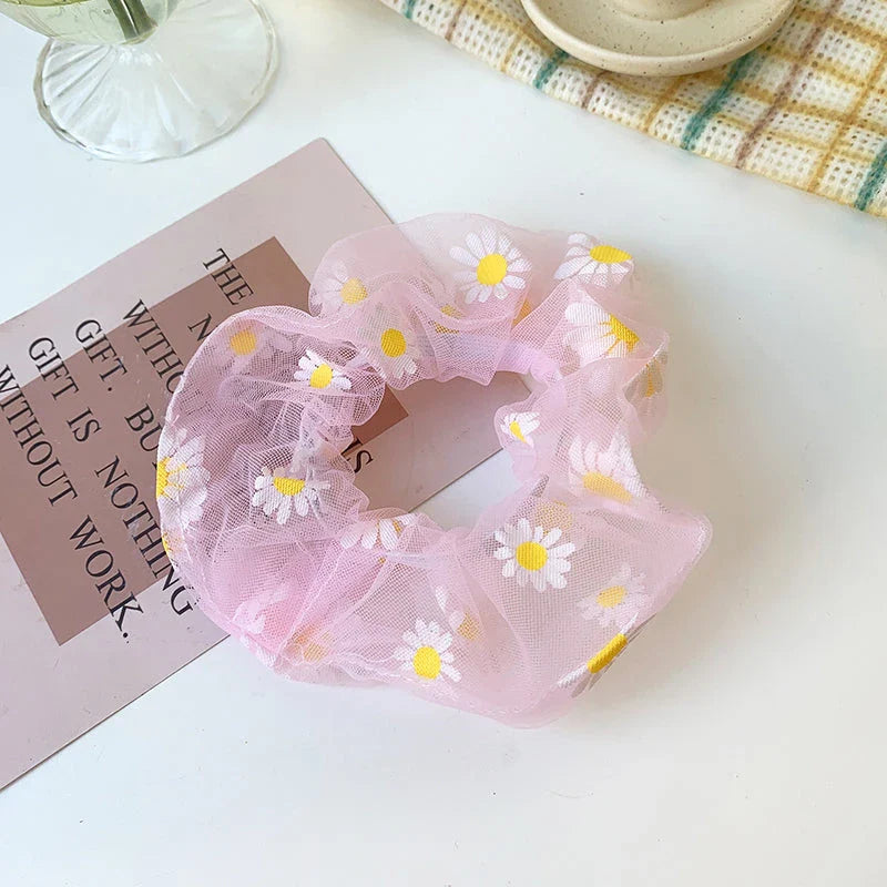 Handmade floral elastic hair bands with soft chiffon fabric and vibrant embroidered daisy patterns, perfect for enhancing everyday style in the UK.