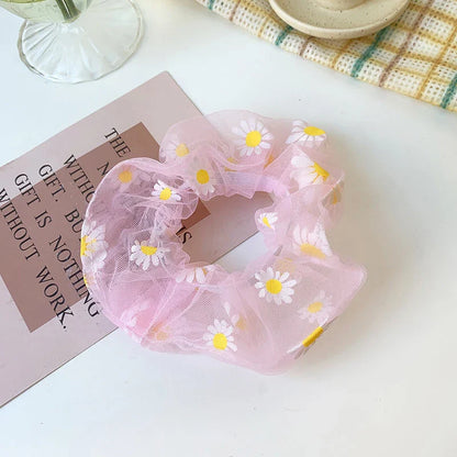 Handmade floral elastic hair bands with soft chiffon fabric and vibrant embroidered daisy patterns, perfect for enhancing everyday style in the UK.