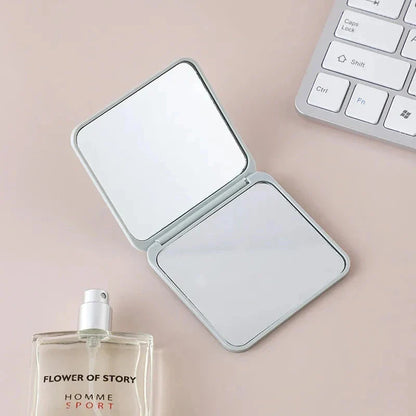 Portable Folding Double-Sided Makeup Mirror in Blue, Pink, Black, and Silver Colours