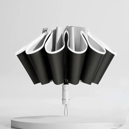 Premium auto-open reverse folding umbrella with reflective safety strip for all-weather protection