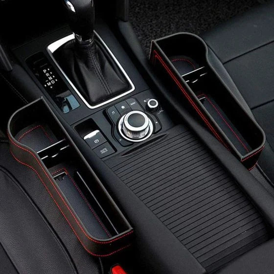 Premium multifunctional car seat organiser with various compartments for storing phones, chargers, pens, and other car essentials