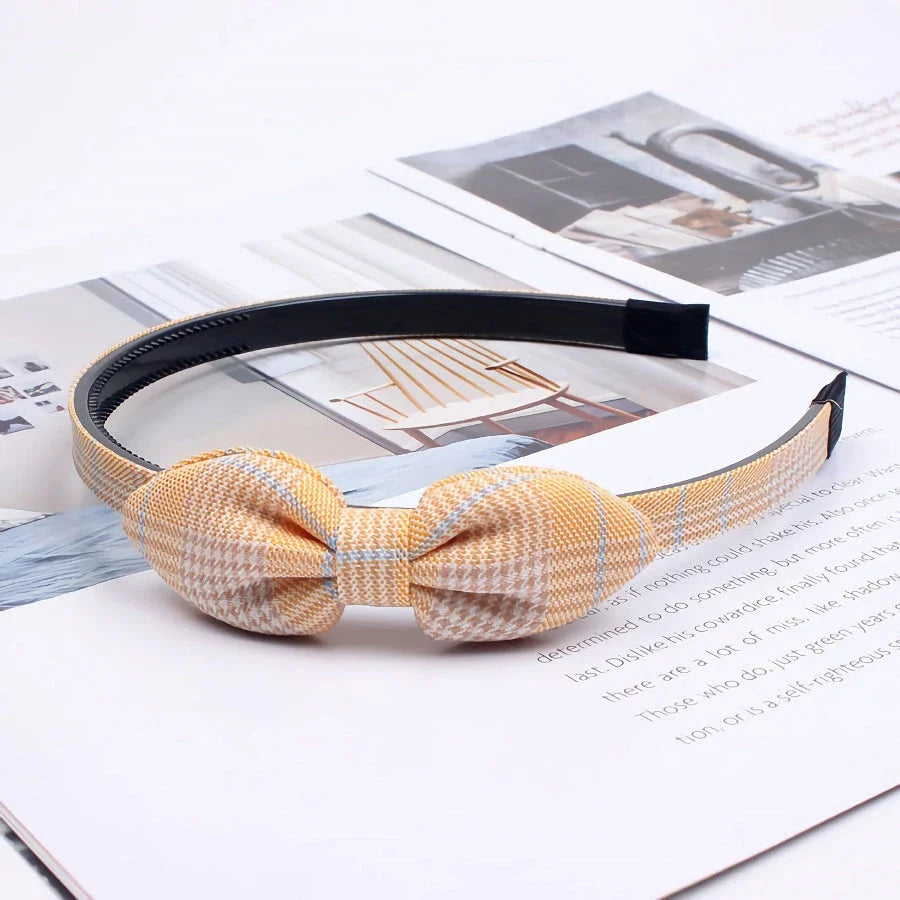Charming bow headband for girls, a stylish hair accessory made from high-quality canvas and rubber for a comfortable, secure fit