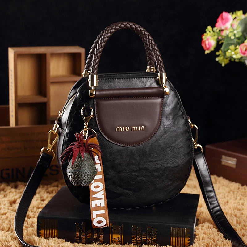 Fashionable women's one-shoulder diagonal bag in caramel, nude pink, black, wine red, and retro brown colours