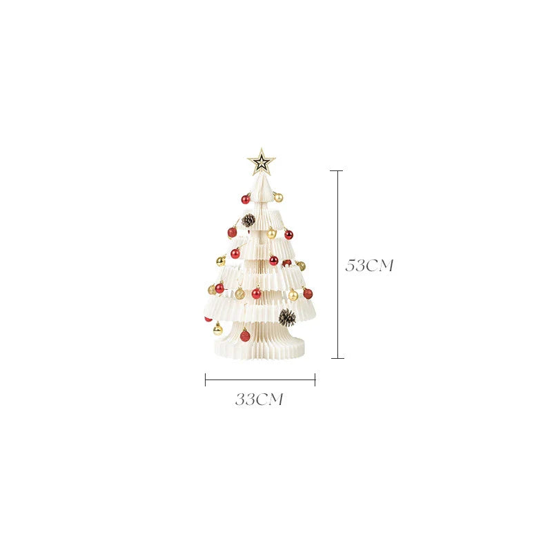A beautifully crafted origami Christmas tree decoration in a Nordic-inspired style, with a warm, glowing illumination