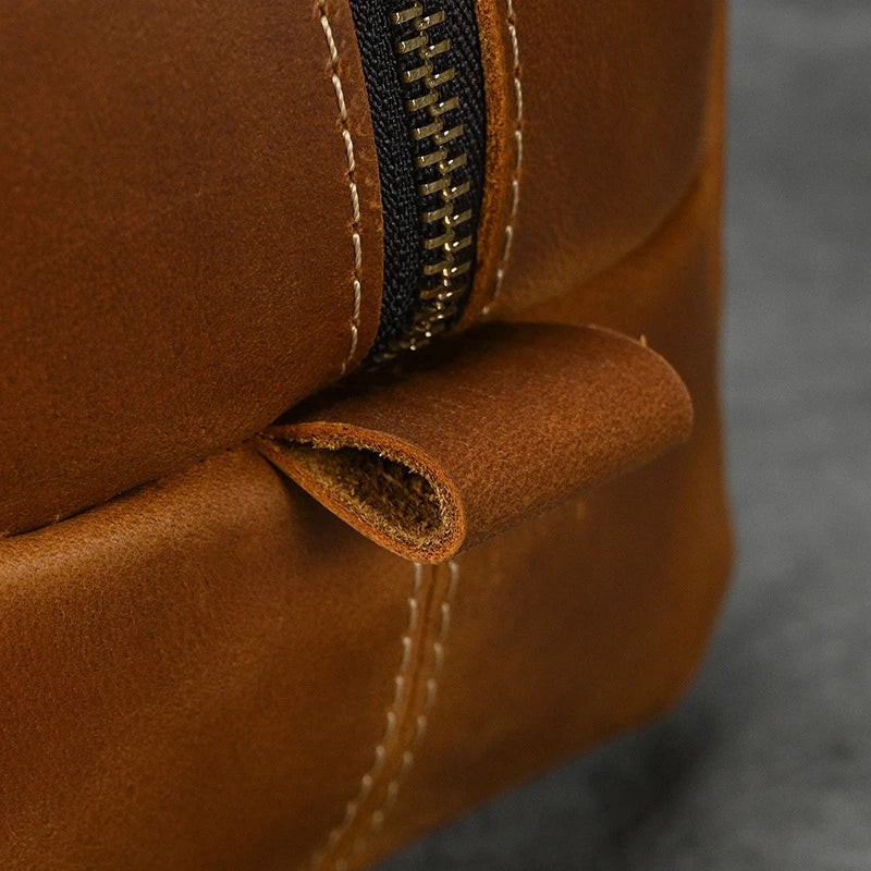 Premium leather clutch bag with multiple interior pockets, designed for the sophisticated British gentleman