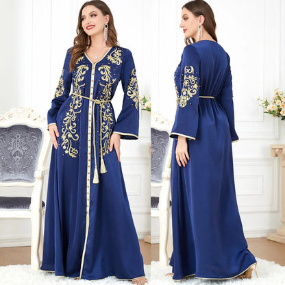 Elegant long-sleeve dress with floral embroidery in a sophisticated sapphire blue colour, suitable for British women