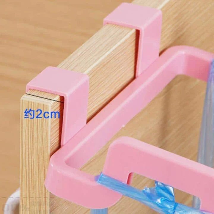 Cupboard-mounted trash bag holder in various colours for organising kitchen waste storage