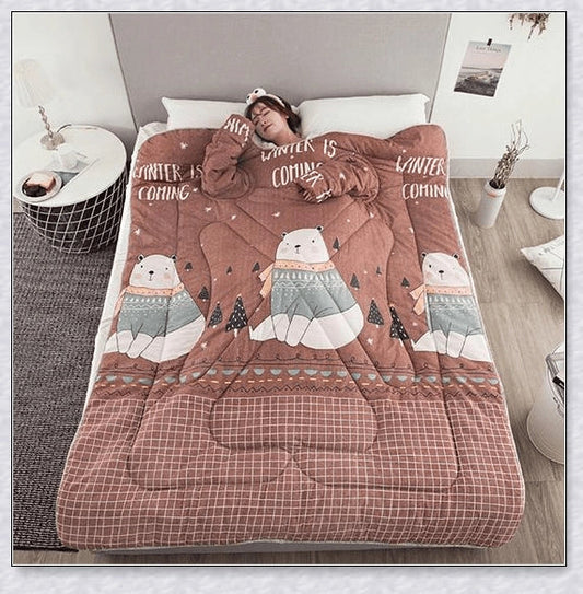 A cosy, wearable quilt with sleeves in a variety of colourful designs, perfect for staying warm and comfortable during the winter months.