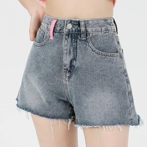 Stylish high-waisted denim shorts with subtle embroidery, perfect for summer fashion