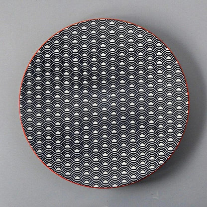Elegant ceramic plates with vibrant, whimsical prints in a variety of enchanting designs