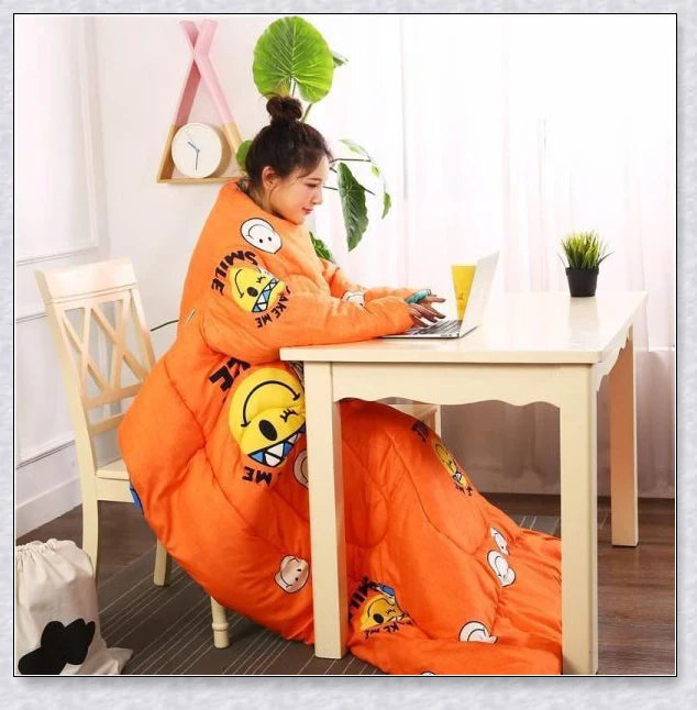 A cosy, wearable quilt with sleeves in a variety of colourful designs, perfect for staying warm and comfortable during the winter months.