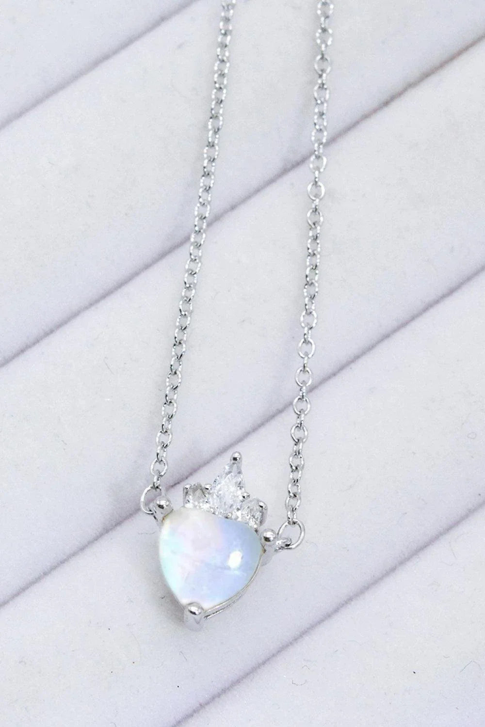 Sterling silver necklace with a natural moonstone heart-shaped pendant