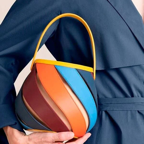 Stylish striped PU leather bucket handbag with versatile carry options and roomy interior