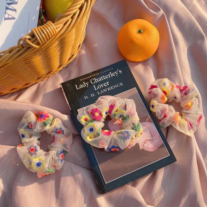 Handmade floral elastic hair bands with soft chiffon fabric and vibrant embroidered daisy patterns, perfect for enhancing everyday style in the UK.