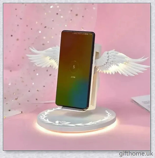 Elegant angel wings-shaped wireless charger with sleek, shiny surface and angelic lighting effect