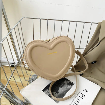 Chic heart-shaped crossbody bag made from premium PU leather, available in multiple stylish colours