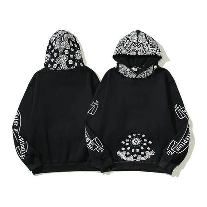 A cosy, fleece-lined hoodie with a classic paisley pattern, a relaxed fit, and practical side pockets for easy style and comfort.