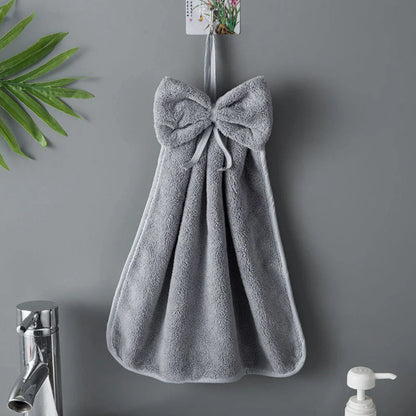 Elegant coral fleece hand towels with a unique bow design, perfect for kitchen and bathroom use