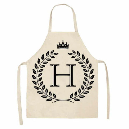 A high-quality kitchen apron featuring a charming crown and letter print design in a premium cotton and linen blend fabric.