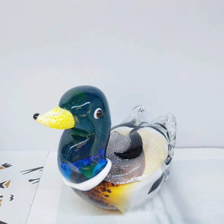 Handcrafted glass ornament in the shape of a Mandarin duck with vibrant colours and intricate details