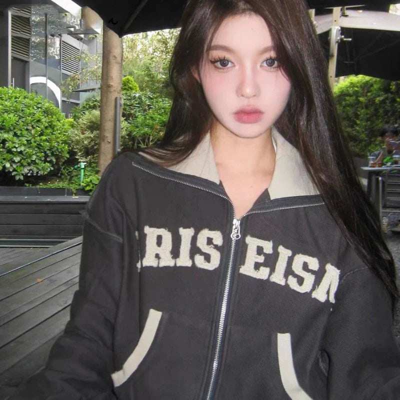 A premium retro-inspired women's sweater jacket made of high-quality polyester with a loose, comfortable fit and a timeless design.