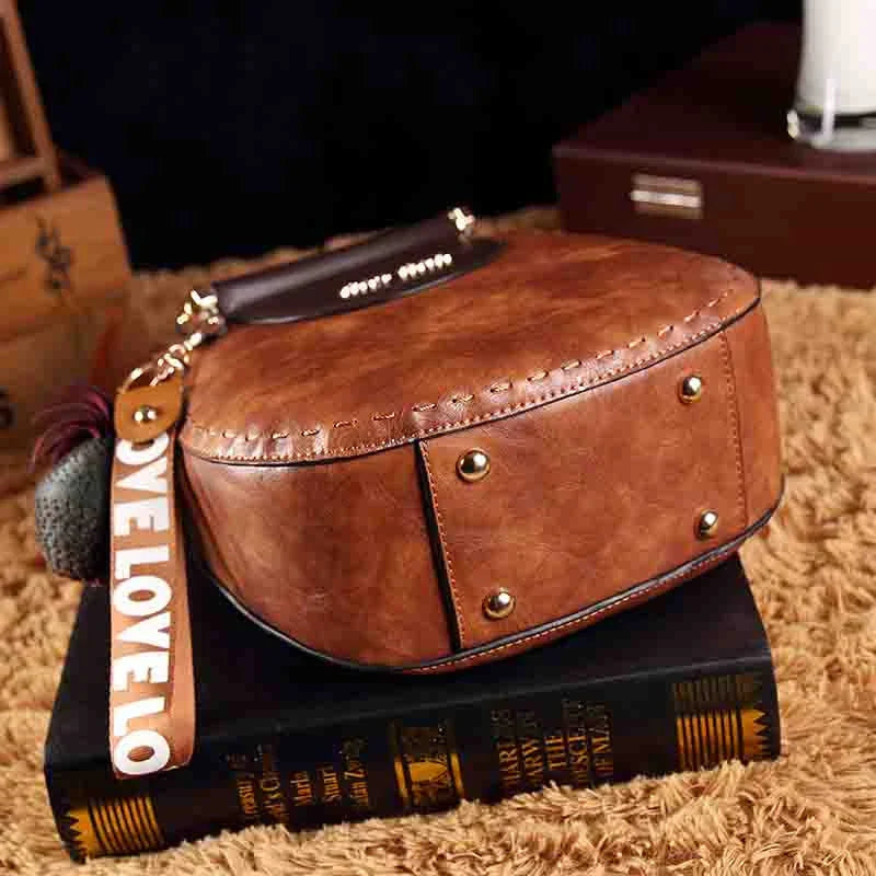 Fashionable women's one-shoulder diagonal bag in caramel, nude pink, black, wine red, and retro brown colours