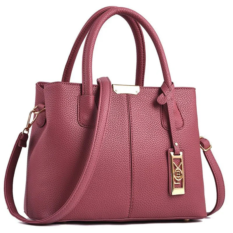 A stylish one-shoulder tote bag in various colours, made of premium polyester with an adjustable strap and spacious interior for the modern professional woman.