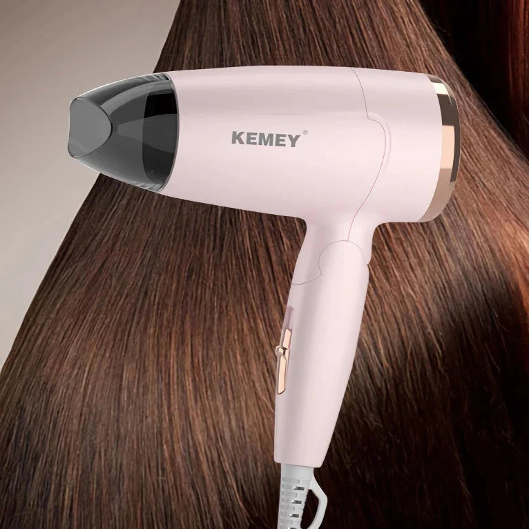Compact and foldable hair dryer with powerful 950-watt motor for efficient styling on the go