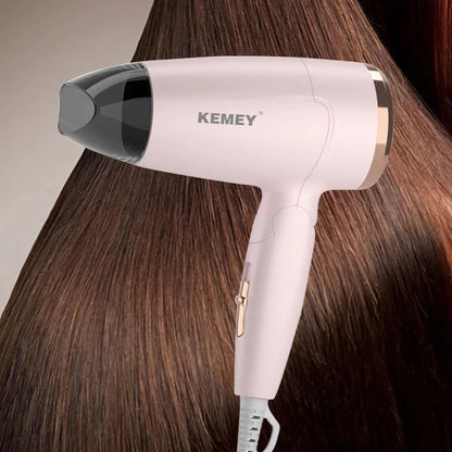 Compact and foldable hair dryer with powerful 950-watt motor for efficient styling on the go