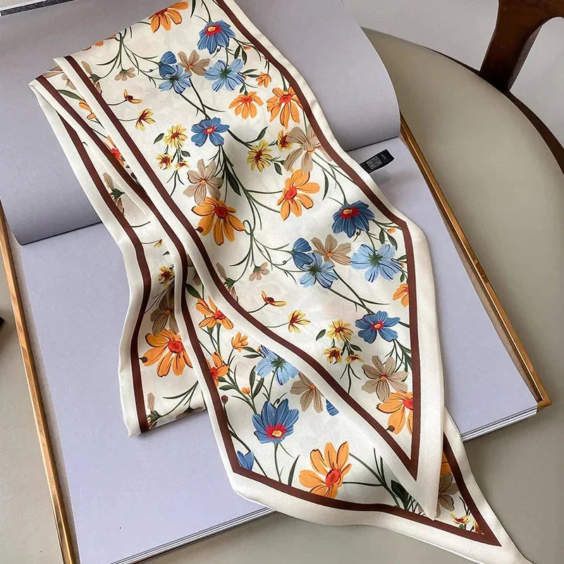 Elegant floral print polyester scarf with a soft, cotton-like texture for versatile seasonal wear
