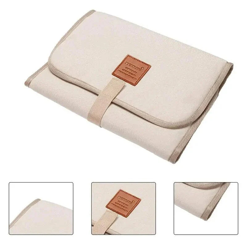 Premium waterproof changing pad for babies, featuring a compact, foldable design and soft, skin-friendly materials for a comfortable, hygienic nappy changing experience on the go.