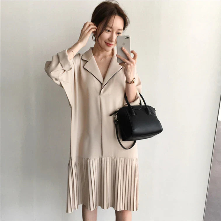 Premium Pleated Suit Dress in Timeless Beige featuring a V-neck, long sleeves, and a mid-length skirt with unique fold stitching detail