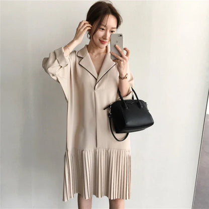 Premium Pleated Suit Dress in Timeless Beige featuring a V-neck, long sleeves, and a mid-length skirt with unique fold stitching detail