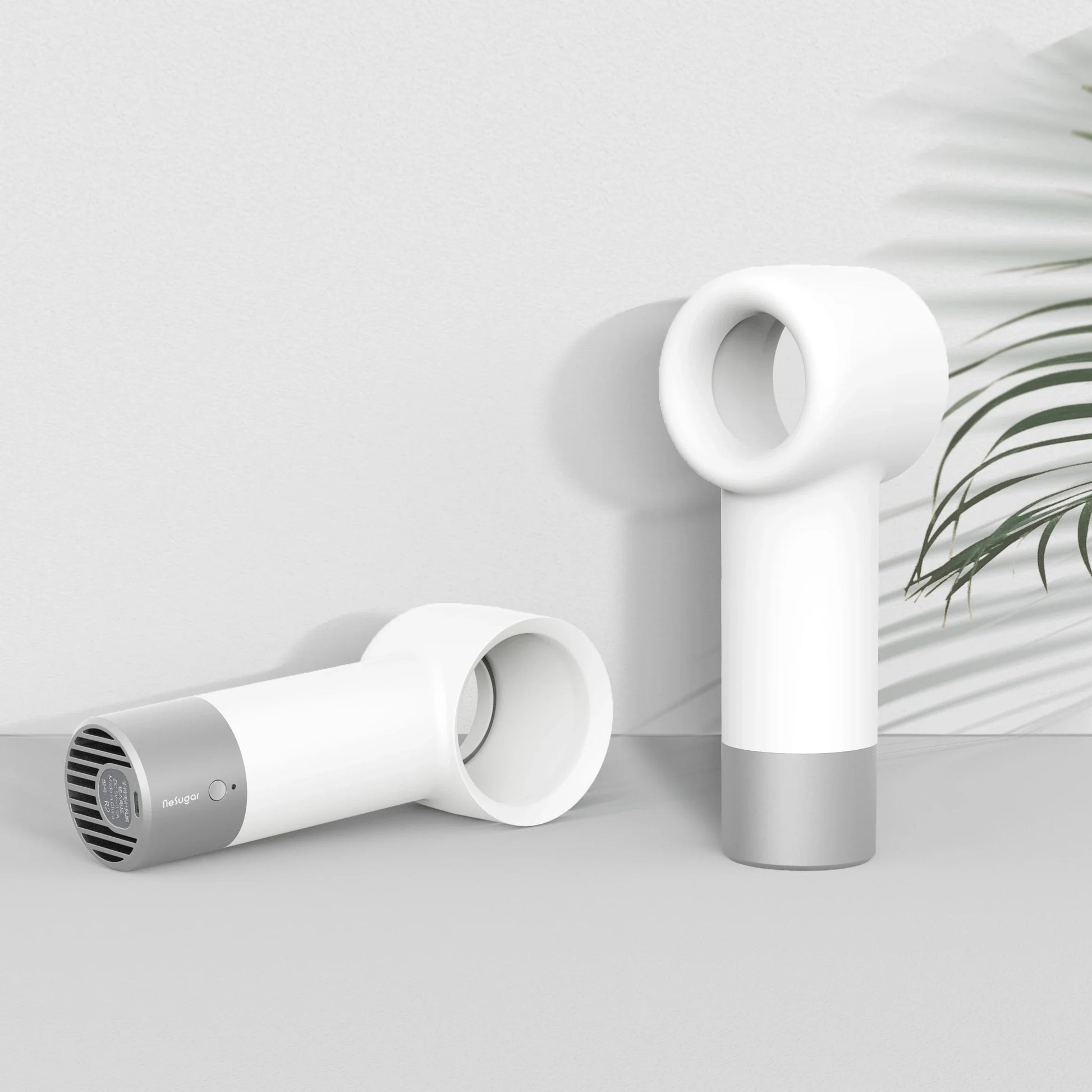 Compact, cordless, and bladeless fan with a sleek, white design and a powerful 900mAh battery for portable cooling.