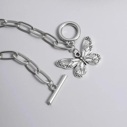Silver butterfly pendant bracelet with a delicate chain and charming bowknot design