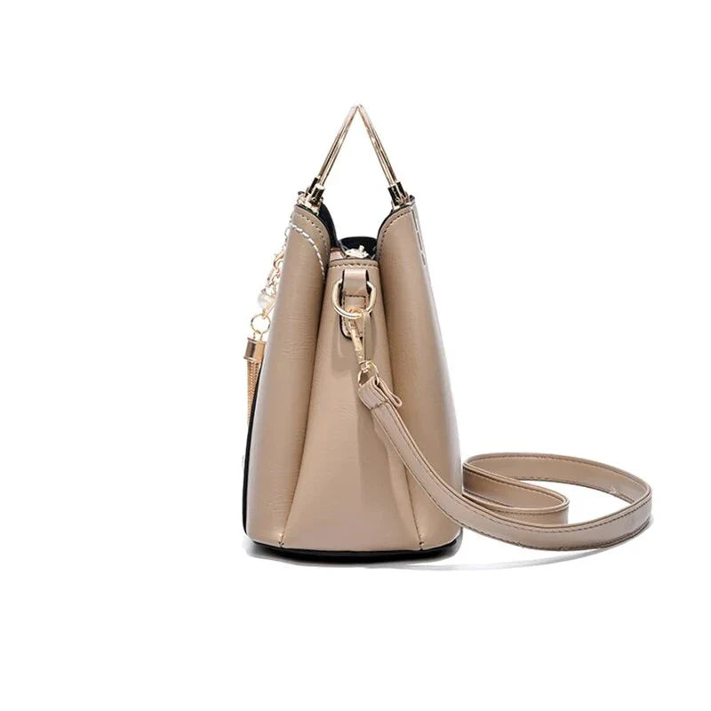 Sophisticated navy blue PU leather bucket crossbody bag with elegant patchwork design and adjustable strap