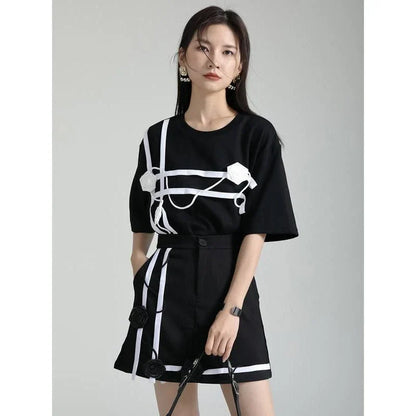 A stylish black and white floral half-sleeve casual t-shirt with a classic round neckline, perfect for everyday wear.