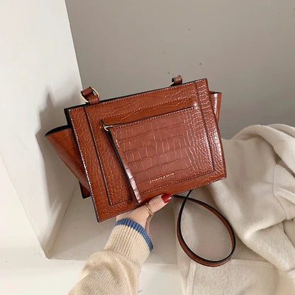 Premium British-designed messenger bag in wine red colour, featuring a spacious and stylish design with a single strap for comfortable carrying.