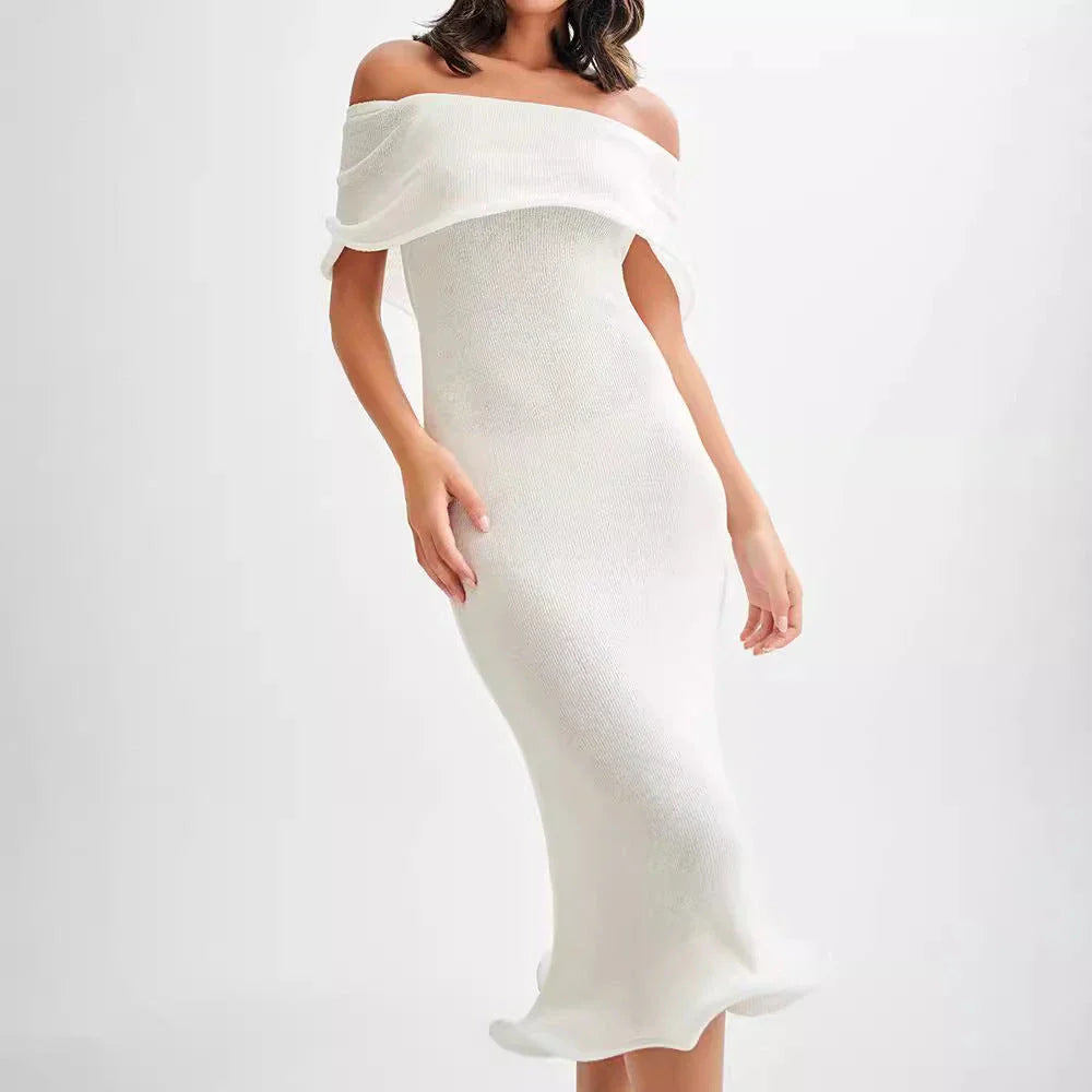 Chic white sleeveless dress with slim-fit silhouette, perfect for stylish occasions in the UK