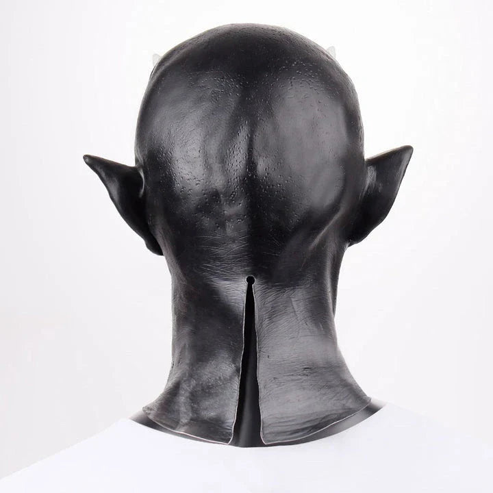 A close-up view of a black latex mask with twisted, menacing horns, creating a fearsome demonic appearance for Halloween costumes and parties.