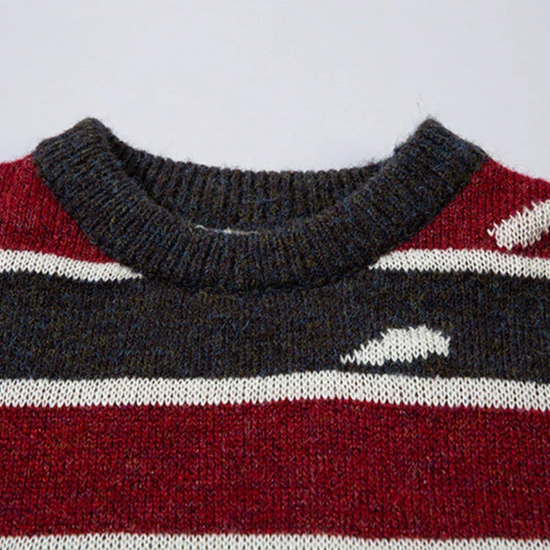 A cosy and stylish jumper featuring a patchwork design with contrasting stripes in a classic British colour palette.