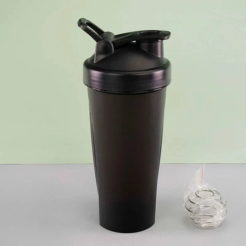 Premium protein shaker bottle with stainless steel whisk ball, BPA-free plastic, and leak-proof design for on-the-go fitness enthusiasts in the UK.
