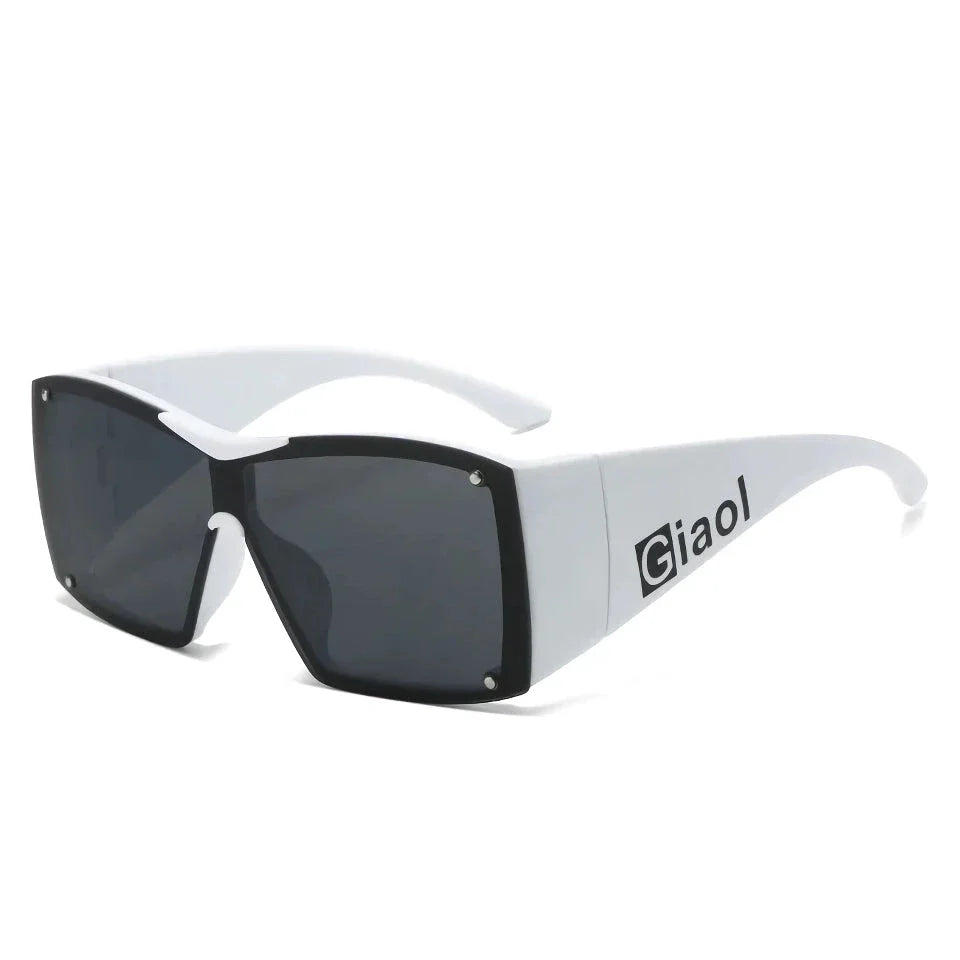 Oversized square sunglasses with black lenses and a durable plastic frame, offering UV400 protection and adaptive photochromic technology.