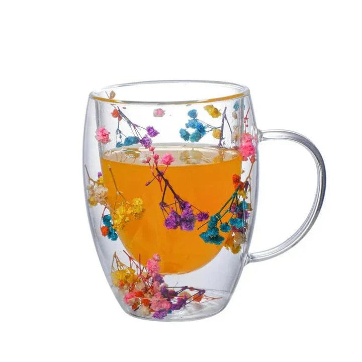 Elegant double-walled glass tea mug with captivating floral display, perfect for hot and cold beverages