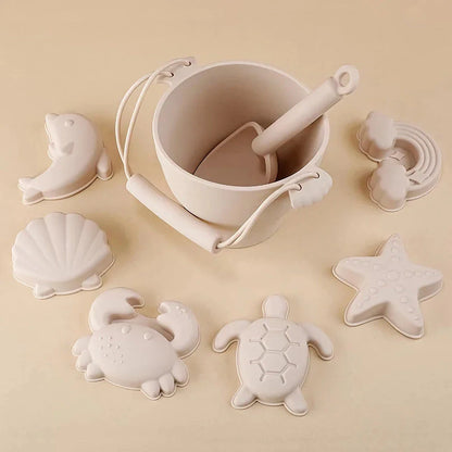 Premium eco-friendly silicone beach playset with bucket, spades, and themed molds for children's creative outdoor play