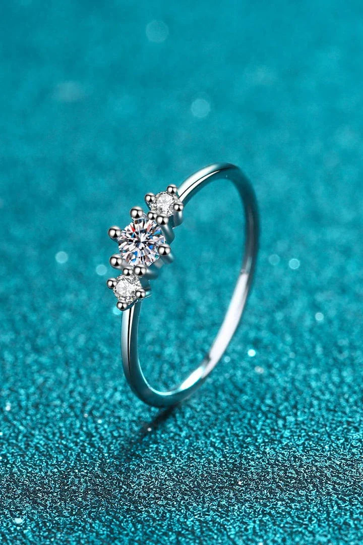 Dazzling sterling silver ring featuring a sparkling moissanite centre stone, perfect for date nights and special occasions.