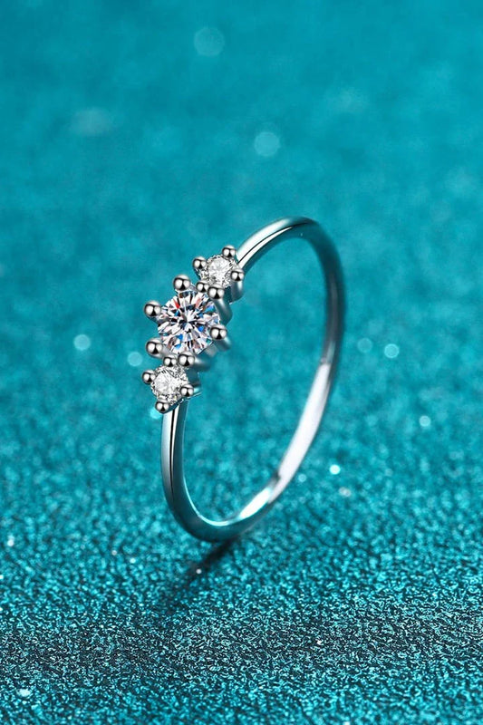 Dazzling sterling silver ring featuring a sparkling moissanite centre stone, perfect for date nights and special occasions.